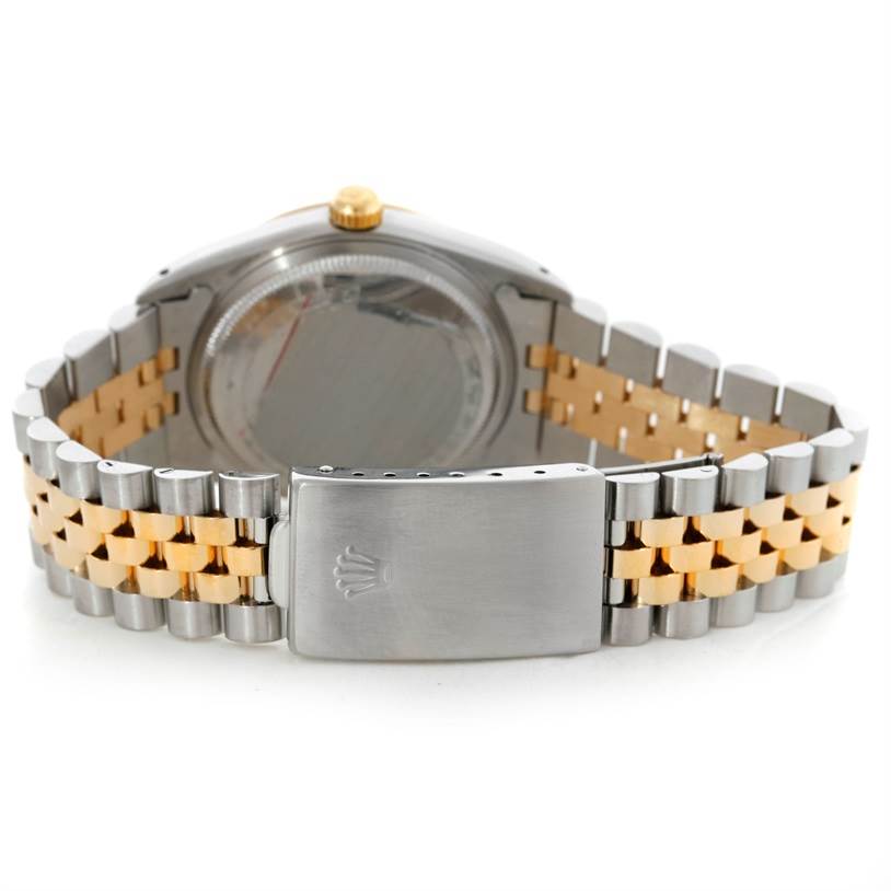 The image shows the back view of a Rolex Datejust 15223 Men's Steel and Gold (two tone) White Dial 15223 Men's Steel and Gold (two tone) White Dial watch, highlighting its clasp and two-tone metal bracelet.