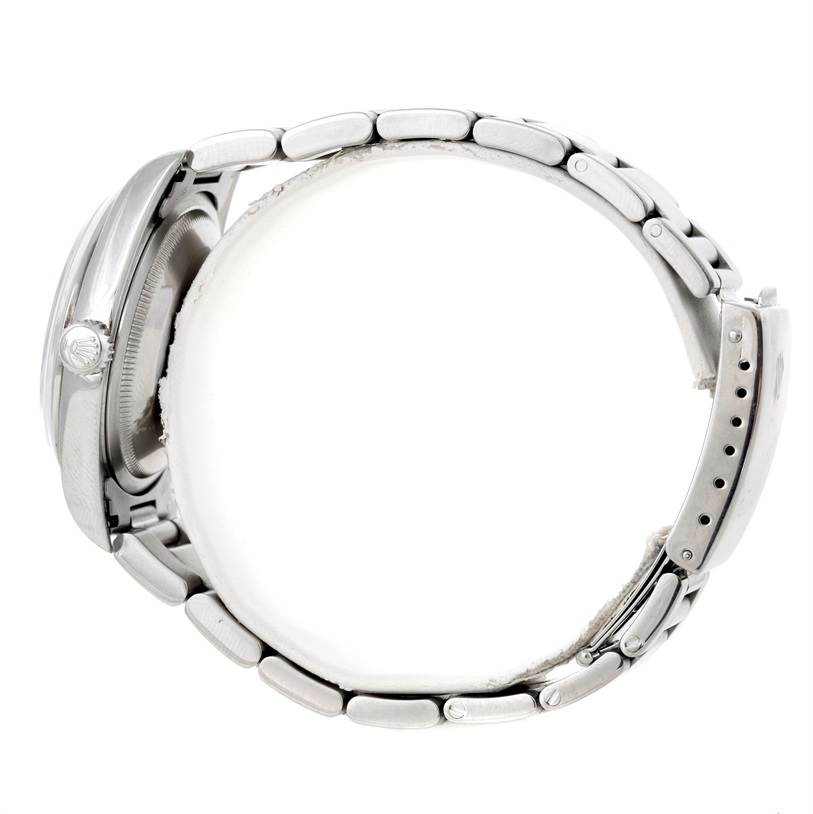 The image shows a side view of a Rolex Datejust 16200 Men's Stainless Steel Silver Dial 16200 Men's Stainless Steel Silver Dial watch, highlighting the crown, case, and bracelet with clasp.