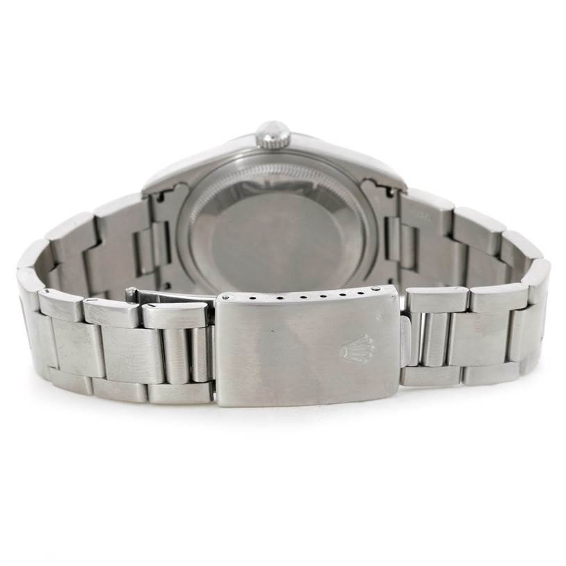 This image shows the back of a Rolex Datejust 16200 Men's Stainless Steel Silver Dial 16200 Men's Stainless Steel Silver Dial watch and its bracelet clasp.