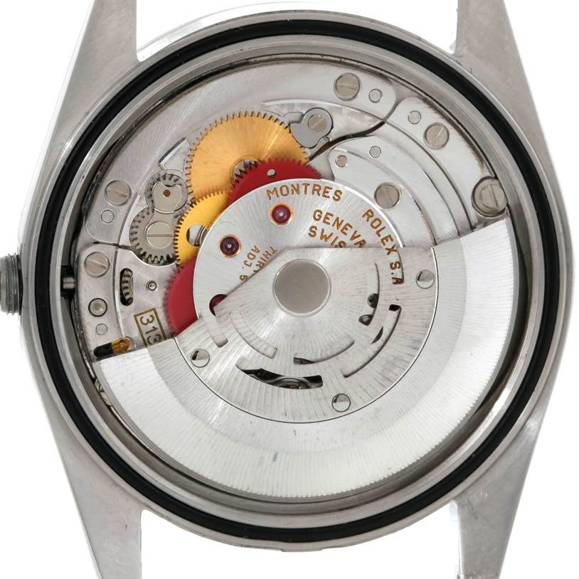 The image shows the intricate inner workings of a Rolex Datejust 16234 Men's Stainless Steel Silver Dial 16234 Men's Stainless Steel Silver Dial watch, viewed from the back case.