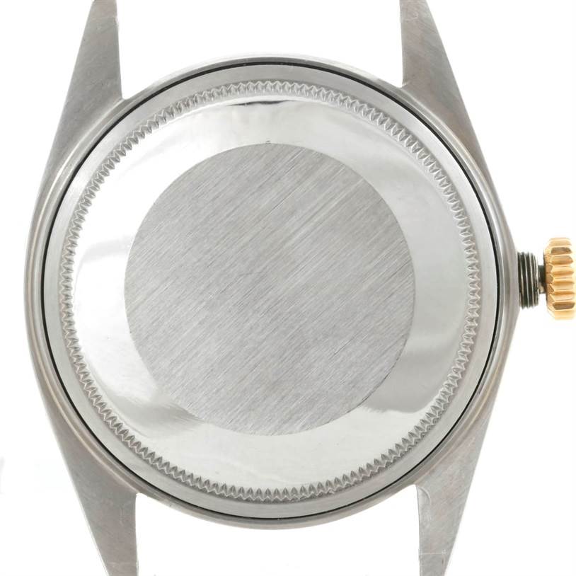 The image shows the back case and crown of a Rolex Datejust 1601 Men's Stainless Steel Brown Dial 1601 Men's Stainless Steel Brown Dial watch from a top-down angle.