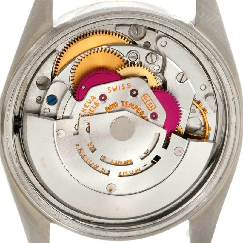This image shows the internal mechanism of a Rolex Datejust 1601 Men's Stainless Steel Brown Dial 1601 Men's Stainless Steel Brown Dial watch from a top-down angle, revealing gears and movement parts.
