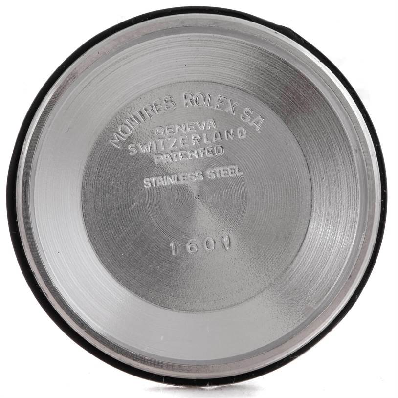 This image shows the inside case back of a Rolex Datejust 1601 Men's Stainless Steel Brown Dial 1601 Men's Stainless Steel Brown Dial model watch, revealing inscriptions and model number 1601.