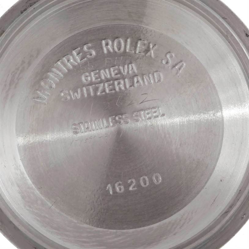 This image shows the inside casing back of a Rolex Datejust 16233 Men's Steel and Gold (two tone) Champagne Dial 16233 Men's Steel and Gold (two tone) Champagne Dial model, highlighting the engraved brand markings and model number.