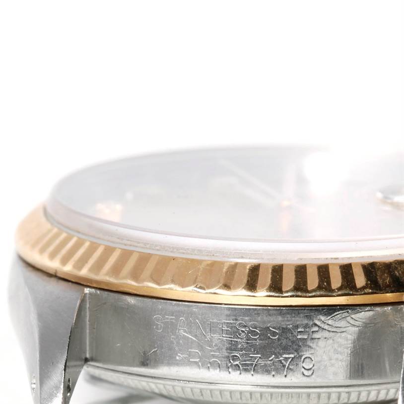 This close-up side view shows the case, bezel, and partial crystal of a Rolex Datejust 16233 Men's Steel and Gold (two tone) Champagne Dial 16233 Men's Steel and Gold (two tone) Champagne Dial watch.