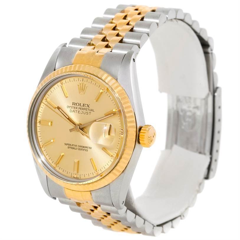 This Rolex Datejust 16013 Men's Stainless Steel Champagne Dial 16013 Men's Stainless Steel Champagne Dial watch is shown at a slight angle, highlighting its gold and silver bracelet, gold dial, and fluted bezel.