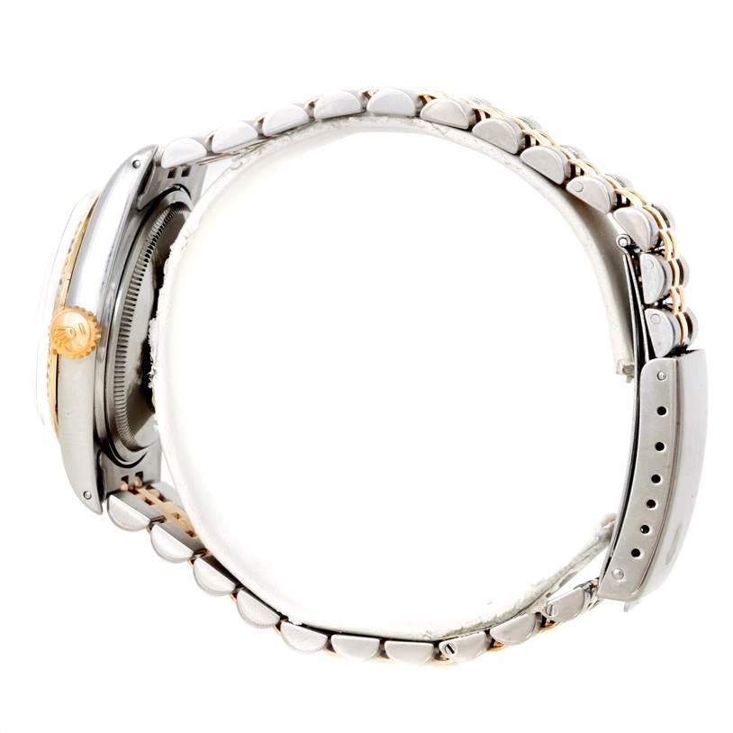 The image shows a side view of a Rolex Datejust 16013 Men's Stainless Steel Champagne Dial 16013 Men's Stainless Steel Champagne Dial watch, focusing on the bracelet and the crown.