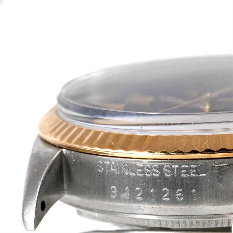 This image shows the side view of a Rolex Datejust 16013 Men's Stainless Steel Black Dial 16013 Men's Stainless Steel Black Dial watch, highlighting the stainless steel case and the fluted bezel.