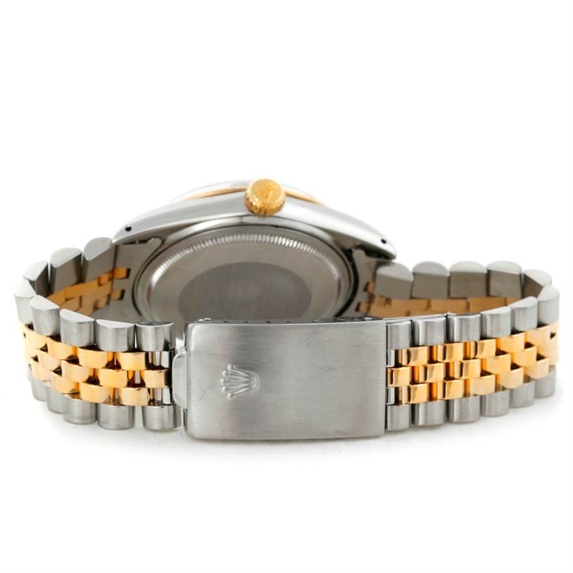 This image shows the back of a Rolex Datejust 16013 Men's Stainless Steel Black Dial 16013 Men's Stainless Steel Black Dial watch, highlighting its two-tone bracelet and clasp.