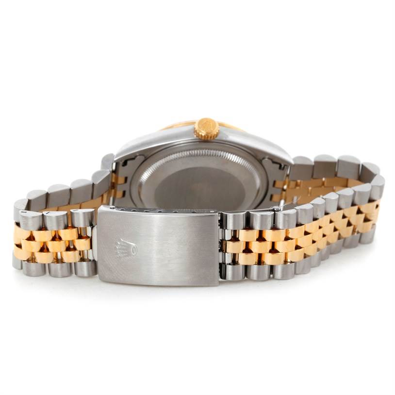 The image shows the Rolex Datejust 16233 Men's Steel and Gold (two tone) Champagne Dial 16233 Men's Steel and Gold (two tone) Champagne Dial watch from the back, highlighting the clasp and the two-tone bracelet.