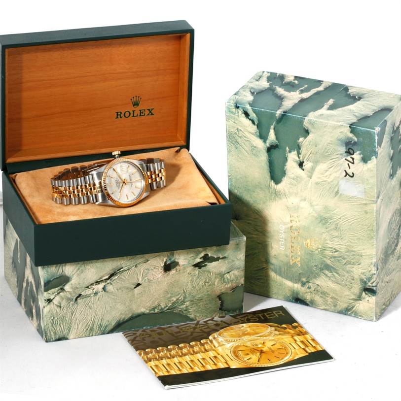 The Rolex Datejust 16013 Men's Stainless Steel Silver Dial 16013 Men's Stainless Steel Silver Dial watch is displayed inside its open box, with an outer box and booklet shown beside it.