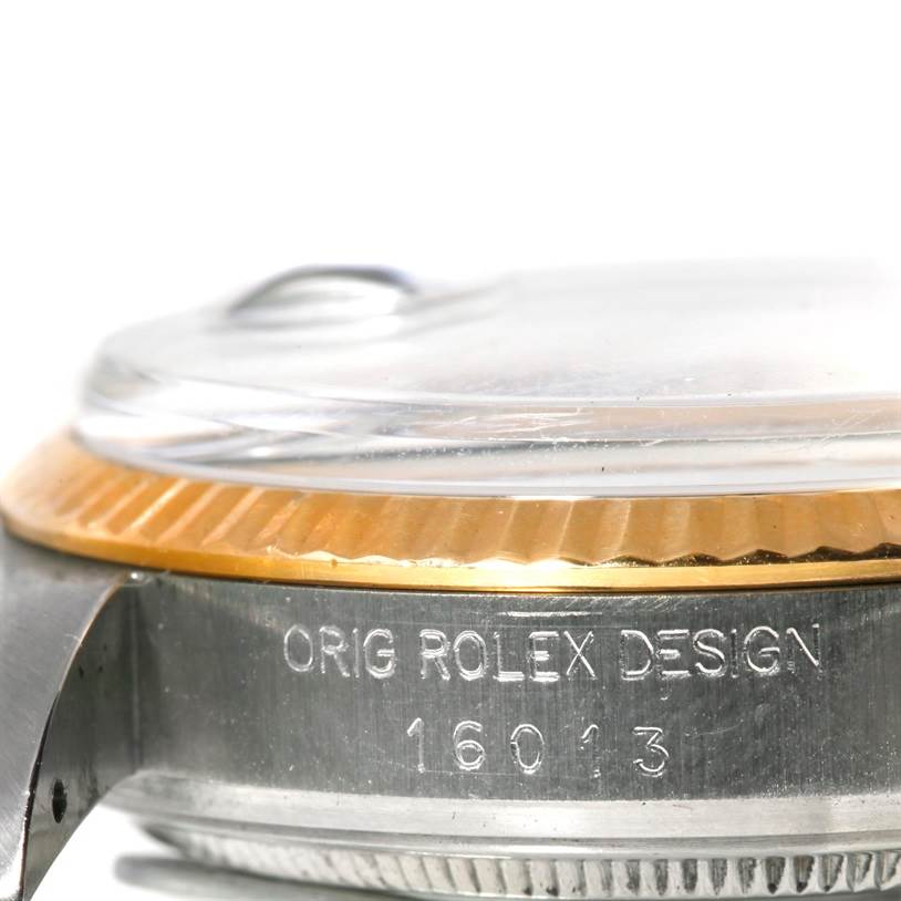 The image shows a close-up side view of a Rolex Datejust 16013 Men's Stainless Steel Silver Dial 16013 Men's Stainless Steel Silver Dial watch, highlighting the case and bezel with engraved text and model number 16013.