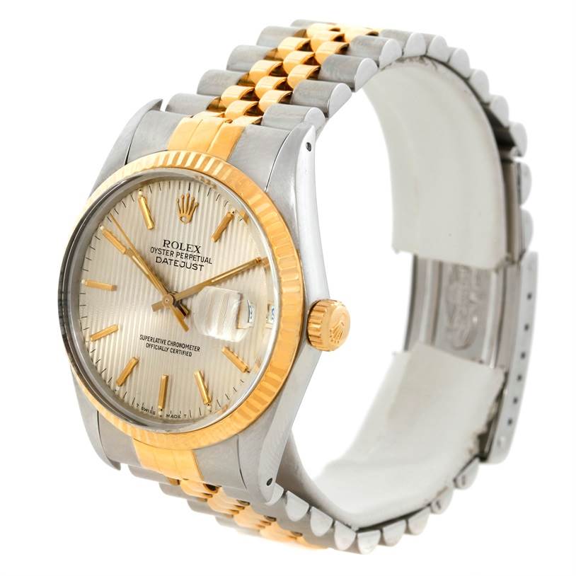 This image shows a side angle of the Rolex Datejust 16013 Men's Stainless Steel Silver Dial 16013 Men's Stainless Steel Silver Dial watch, highlighting the face, crown, and two-tone bracelet.