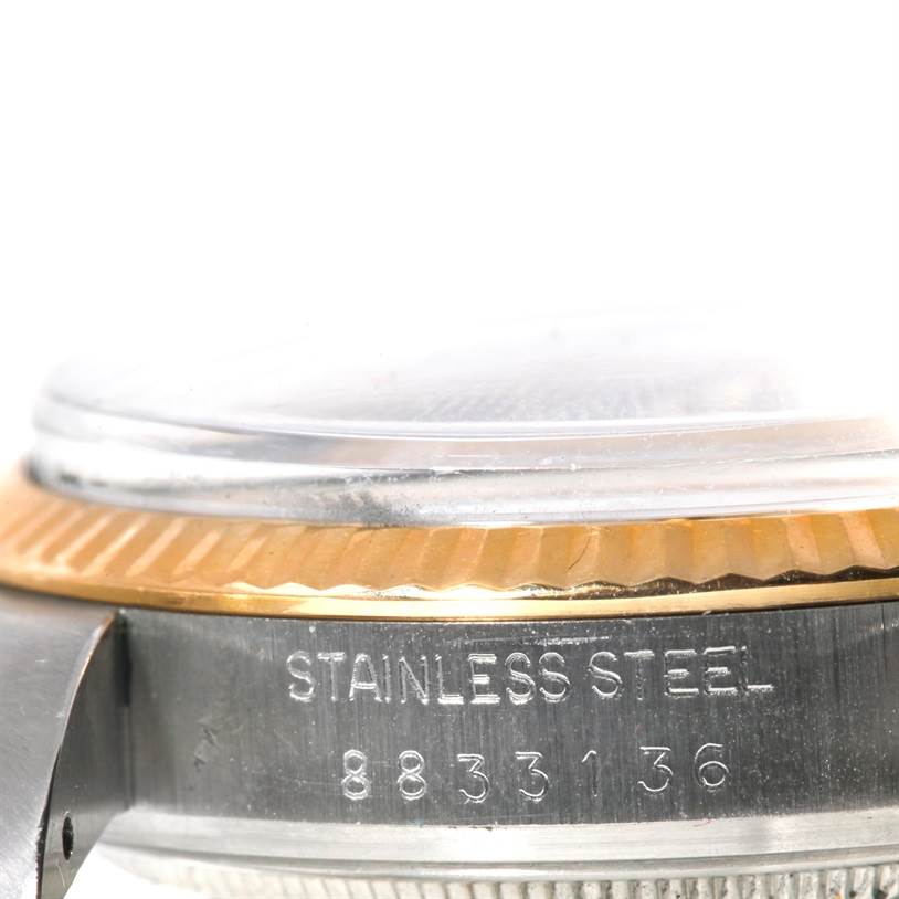 This close-up image shows the side of the case and bezel of a Rolex Datejust 16013 Men's Stainless Steel Silver Dial 16013 Men's Stainless Steel Silver Dial watch, highlighting the "Stainless Steel" engraving and serial number.