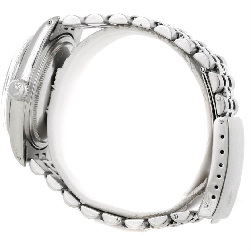 The image shows a side view of a Rolex Datejust 16030 Men
s Stainless Steel Grey Dial 16030 Men
s Stainless Steel Grey Dial watch, focusing on the case, crown, and bracelet.