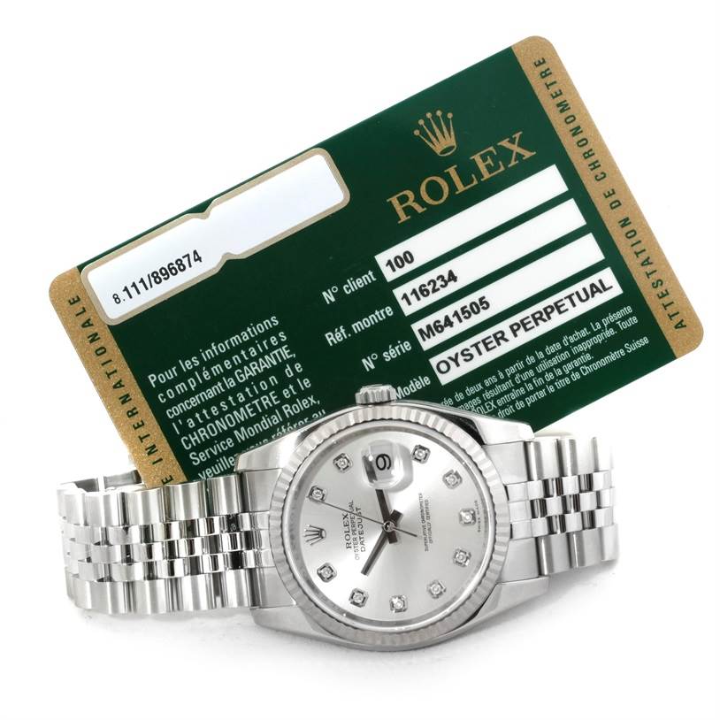 The image shows a Rolex Datejust 116234 Men's Stainless Steel Silver Dial 116234 Men's Stainless Steel Silver Dial watch with a Jubilee bracelet and warranty card positioned behind it.