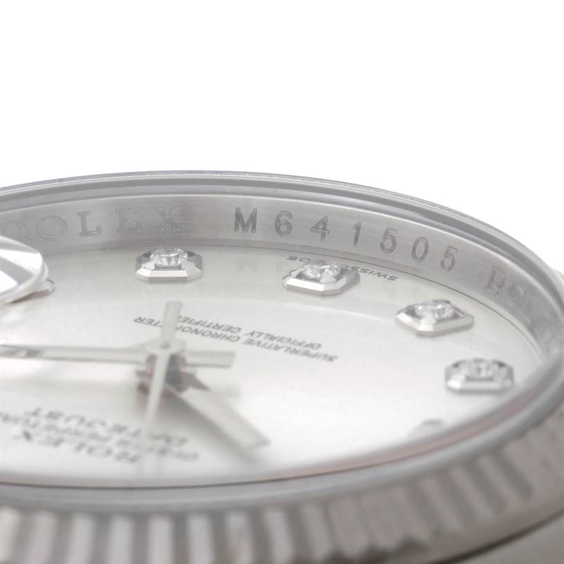 This image shows a close-up of the Rolex Datejust 116234 Men's Stainless Steel Silver Dial 116234 Men's Stainless Steel Silver Dial watch dial and part of the rehaut engraving.