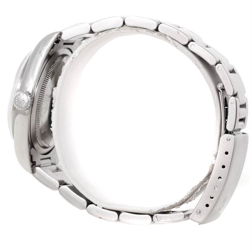 The image shows a side view of a Rolex Datejust 16200 Men's Stainless Steel Silver Dial 16200 Men's Stainless Steel Silver Dial watch, focusing on the bracelet and crown.