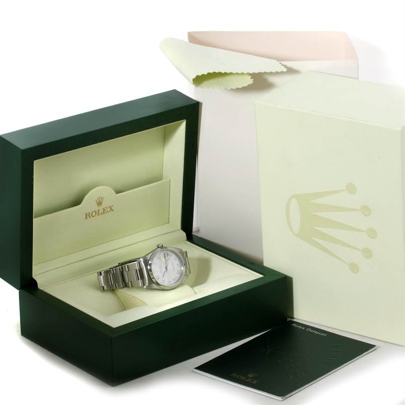 The image shows a Rolex Datejust 16200 Men's Stainless Steel Silver Dial 16200 Men's Stainless Steel Silver Dial watch, placed inside its green presentation box and accompanied by the outer box and manual.