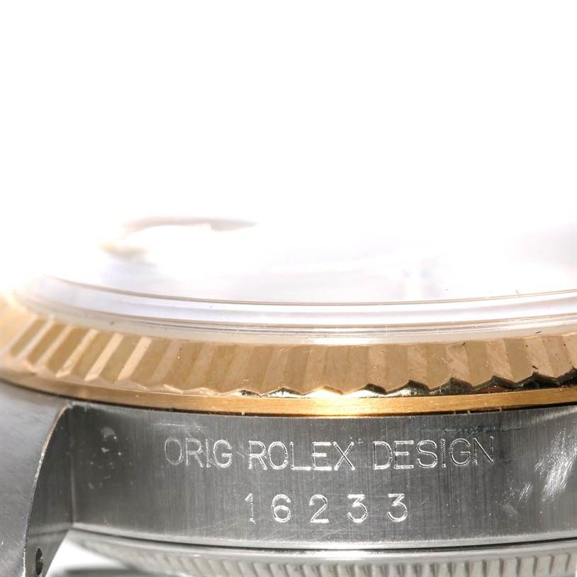 The image shows a close-up side view of the bezel and case of the Rolex Datejust 16233 Men
s Steel and Gold (two tone) Champagne Dial 16233 Men
s Steel and Gold (two tone) Champagne Dial, displaying the model number 16233.