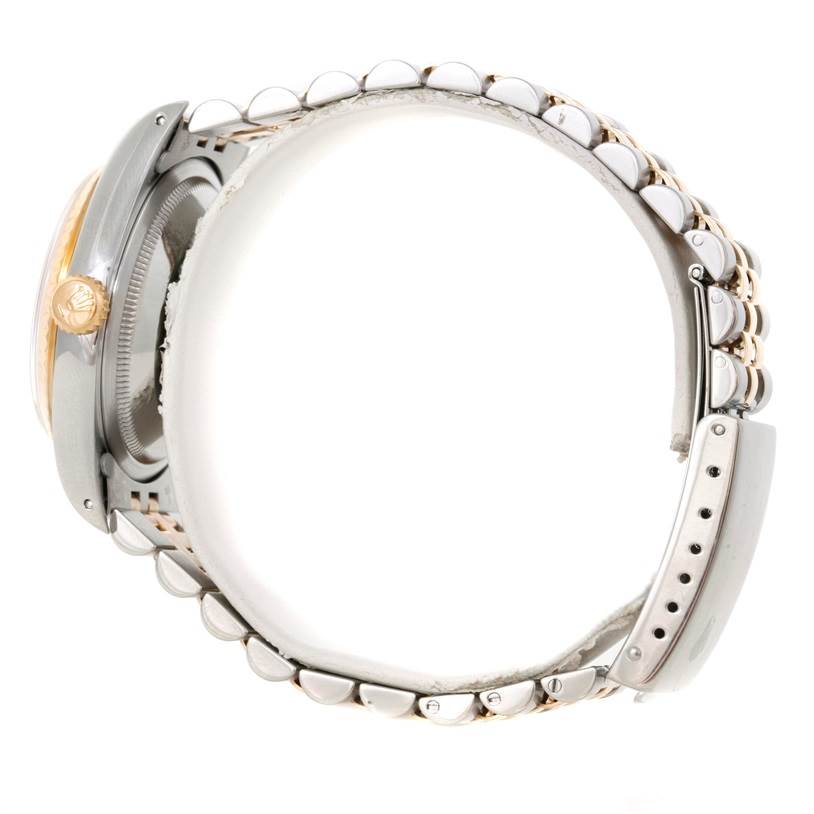 The image shows the side profile and part of the bracelet of the Rolex Datejust 16233 Men
s Steel and Gold (two tone) Champagne Dial 16233 Men
s Steel and Gold (two tone) Champagne Dial watch.