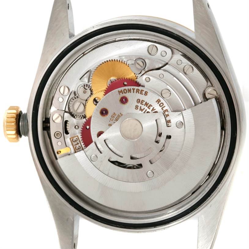 This image shows the back view of a Rolex Datejust 16233 Men
s Steel and Gold (two tone) Champagne Dial 16233 Men
s Steel and Gold (two tone) Champagne Dial watch revealing its internal mechanism.