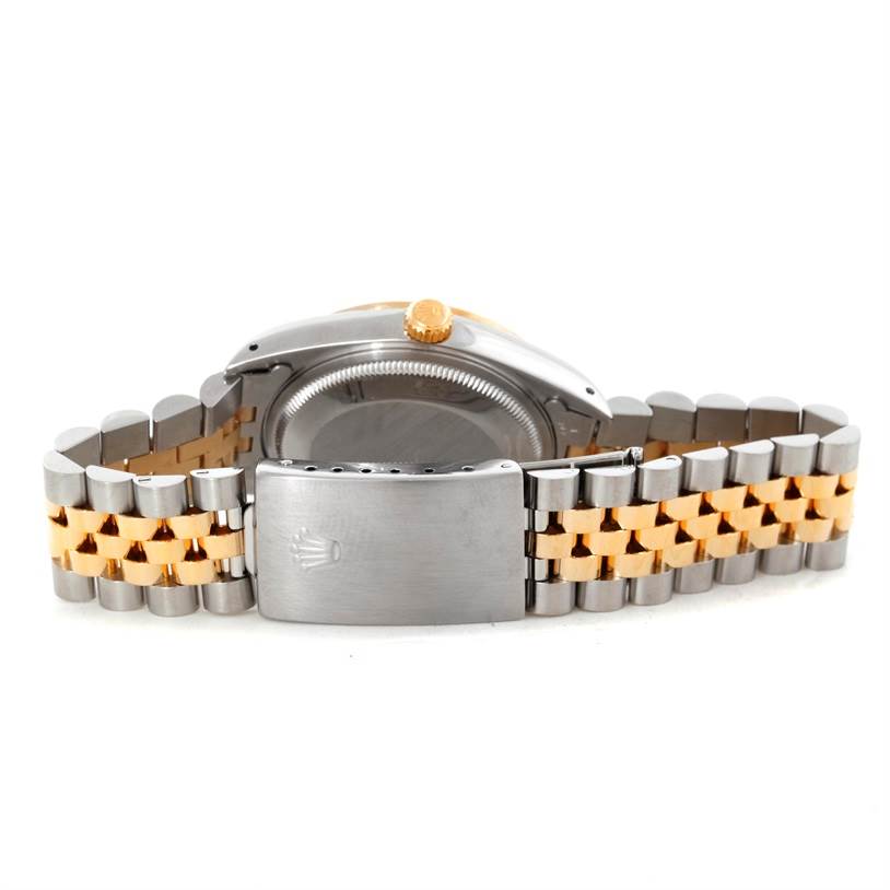 This Rolex Datejust 15223 Men's Steel and Gold (two tone) Black Dial 15223 Men's Steel and Gold (two tone) Black Dial watch is shown from the back, featuring its two-tone Jubilee bracelet and case back.