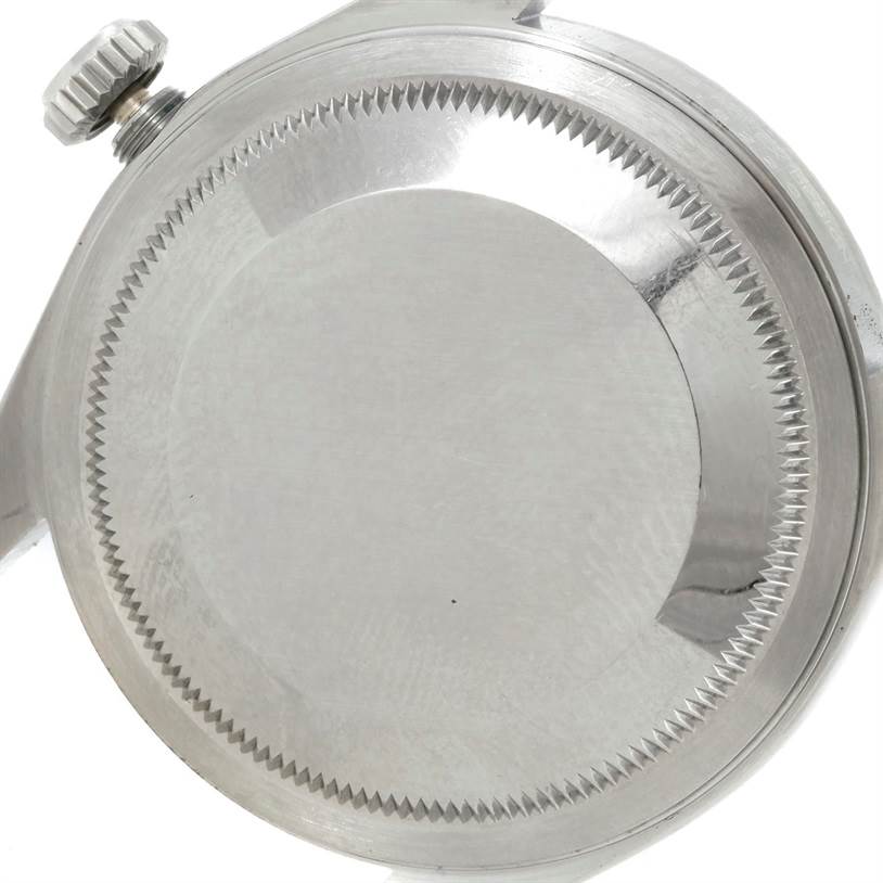 The image shows the back case and crown of a Rolex Datejust 16220 Men's Stainless Steel Silver Dial 16220 Men's Stainless Steel Silver Dial watch from a close-up angle.