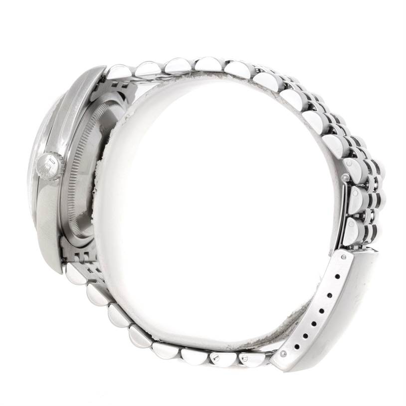 The image shows a side view of a Rolex Datejust 16220 Men's Stainless Steel Silver Dial 16220 Men's Stainless Steel Silver Dial watch, focusing on the case, crown, and bracelet.