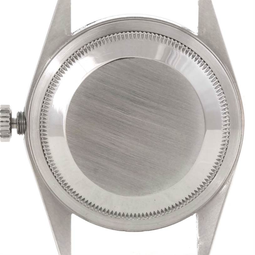 The image shows the back case of a Rolex Datejust 16220 Men's Stainless Steel Silver Dial 16220 Men's Stainless Steel Silver Dial watch from a top-down angle.