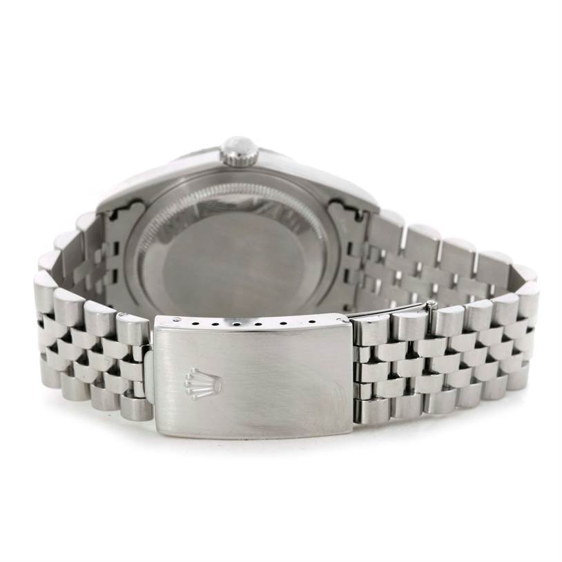 The image shows the back side of a Rolex Datejust 16220 Men's Stainless Steel Silver Dial 16220 Men's Stainless Steel Silver Dial watch, highlighting its clasp and bracelet links.