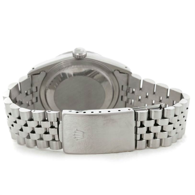 The image shows the back view of a Rolex Datejust 16220 Men
s Stainless Steel Grey Dial 16220 Men
s Stainless Steel Grey Dial watch, highlighting the case back and Jubilee bracelet with a clasp.