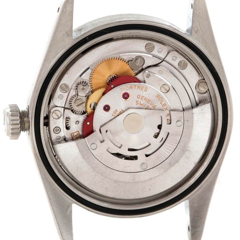 This image shows the movement components and intricate gears of a Rolex Datejust 16220 Men
s Stainless Steel Grey Dial 16220 Men
s Stainless Steel Grey Dial watch from the back.