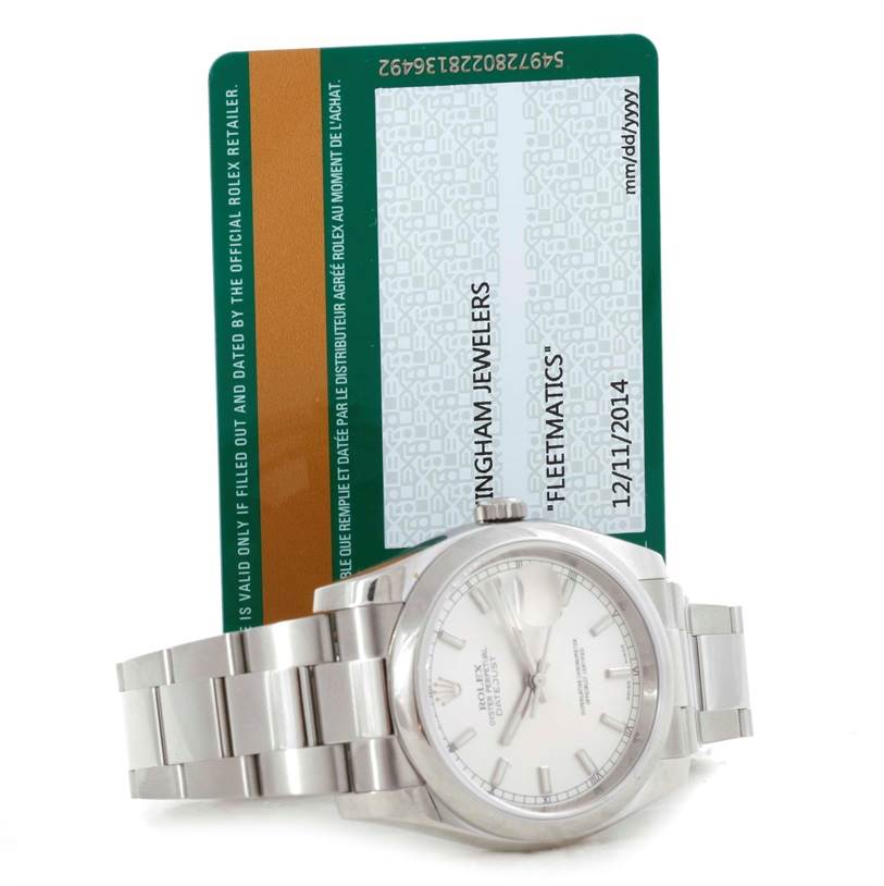 The image shows a Rolex Datejust 116200 Men's Stainless Steel Silver Dial 116200 Men's Stainless Steel Silver Dial watch lying flat with its warranty card positioned behind it.