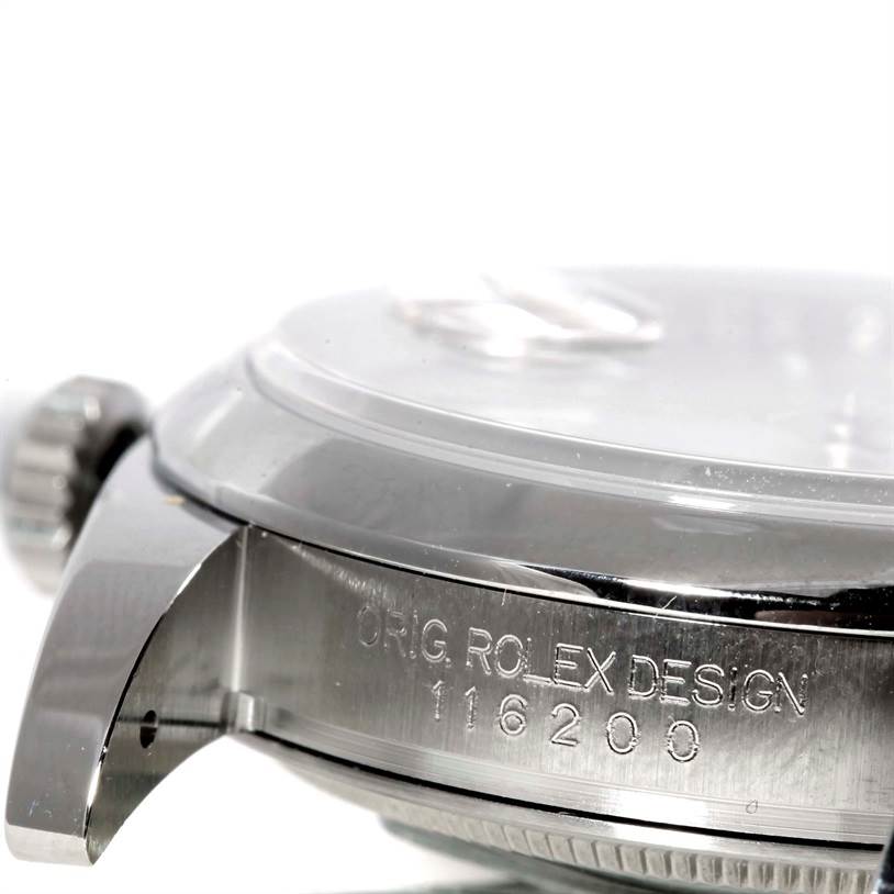 This image shows a close-up side view of a Rolex Datejust 116200 Men's Stainless Steel Silver Dial 116200 Men's Stainless Steel Silver Dial model, highlighting the crown and case with engraved model number.
