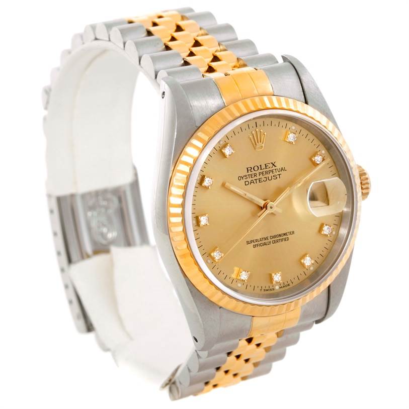 The Rolex Datejust 16233 Men's Steel and Gold (two tone) Champagne Dial 16233 Men's Steel and Gold (two tone) Champagne Dial watch is angled to show the gold and silver bracelet, fluted bezel, champagne dial, and magnified date window.