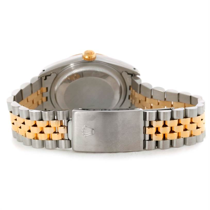 This Rolex Datejust 16233 Men's Steel and Gold (two tone) Champagne Dial 16233 Men's Steel and Gold (two tone) Champagne Dial watch is shown from the back, highlighting its bracelet, clasp, and case back.