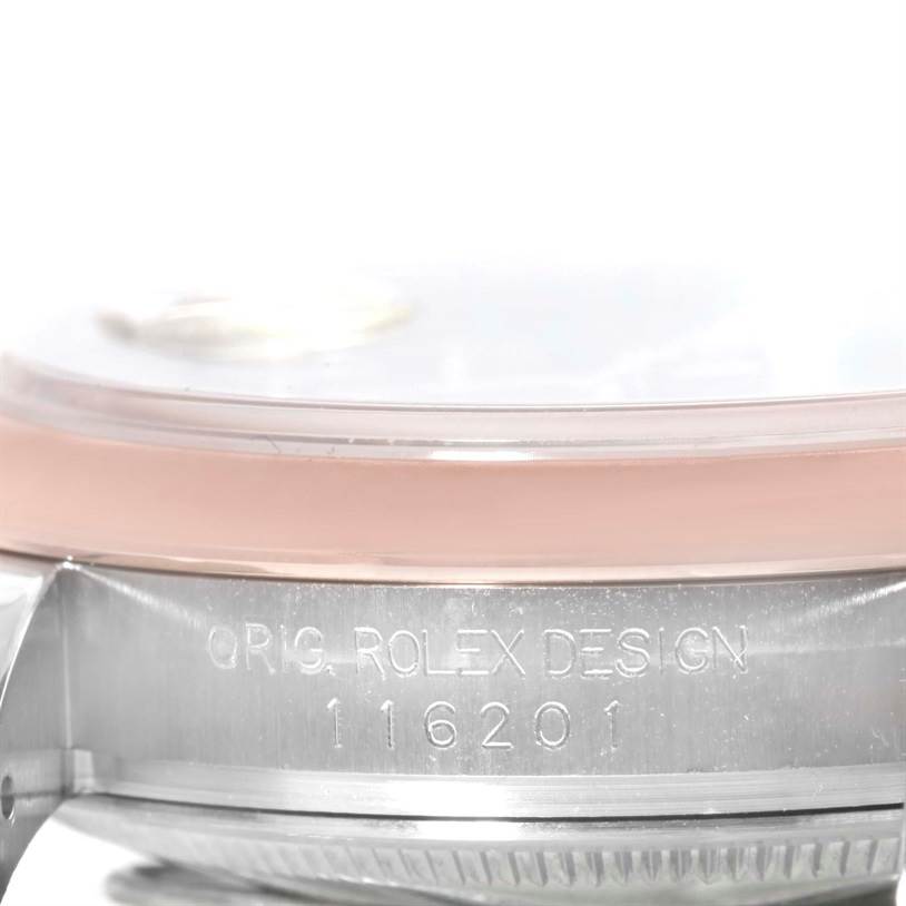 The image shows a close-up of the side of the Rolex Datejust 116201 Men
s Steel and Gold (two tone) Black Dial 116201 Men
s Steel and Gold (two tone) Black Dial watch, highlighting the model number 116201 and engraving on the case.