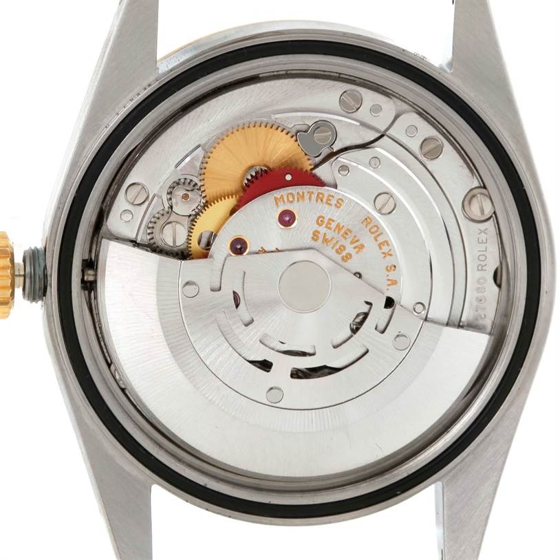 This image shows the inner mechanical movement of a Rolex Datejust 16233 Men's Steel and Gold (two tone) Champagne Dial 16233 Men's Steel and Gold (two tone) Champagne Dial watch from the back, displaying gears and other components.