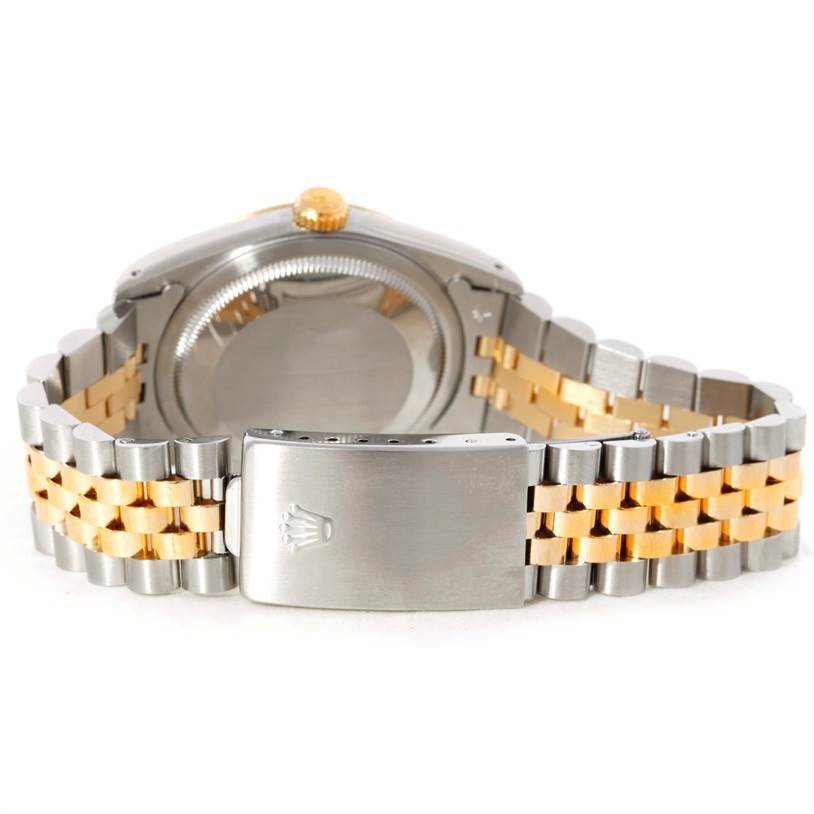 This image shows the back view of a Rolex Datejust 16233 Men's Steel and Gold (two tone) Champagne Dial 16233 Men's Steel and Gold (two tone) Champagne Dial watch, focusing on its clasp, bracelet, and caseback.