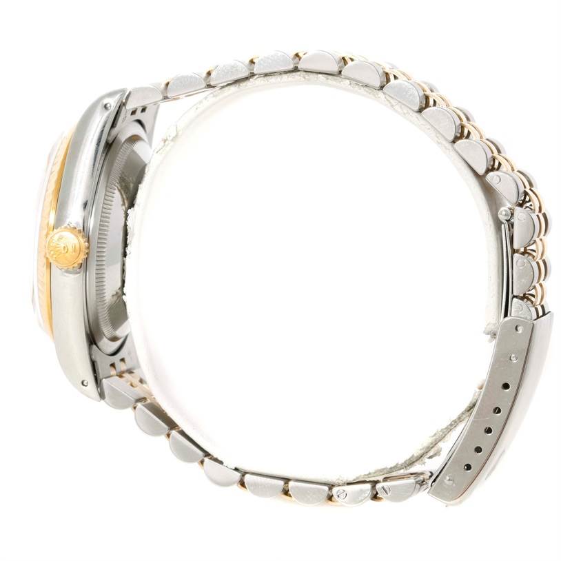 This image shows a side profile view of the Rolex Datejust 16233 Men's Steel and Gold (two tone) Champagne Dial 16233 Men's Steel and Gold (two tone) Champagne Dial watch, highlighting its bezel, crown, and bracelet.