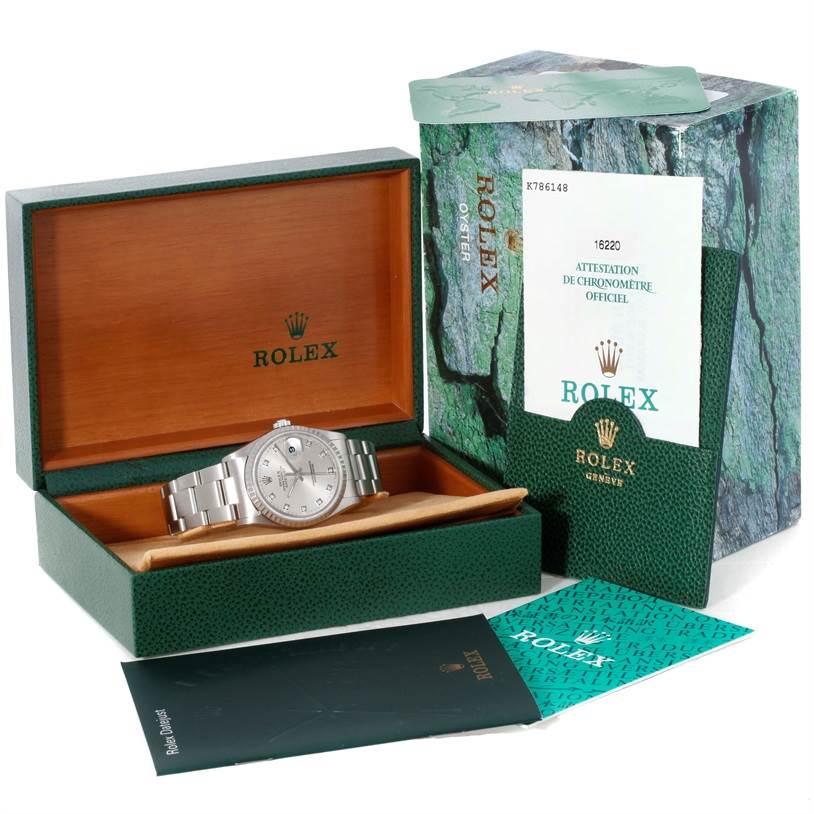 The Rolex Datejust 16220 Men's Stainless Steel Silver Dial 16220 Men's Stainless Steel Silver Dial watch is shown in its open display box with accompanying packaging and booklets.