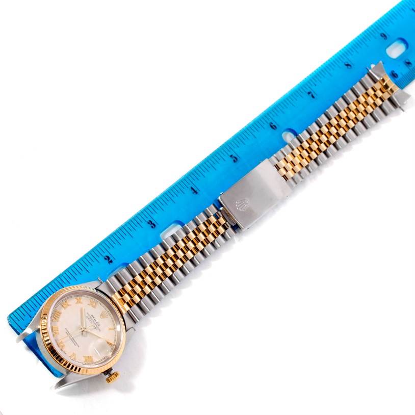 The image shows a Rolex Datejust 16233 Men's Steel and Gold (two tone) Beige Dial 16233 Men's Steel and Gold (two tone) Beige Dial watch laid flat next to a blue ruler, displaying the dial, bezel, crown, and jubilee bracelet.