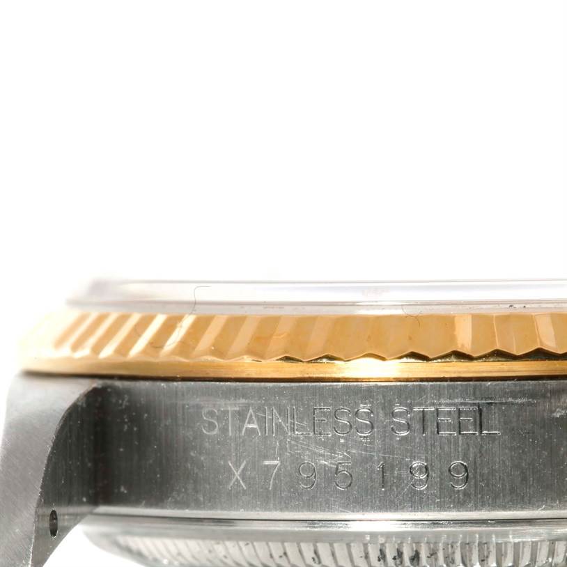 This image shows a close-up side view of the case, bezel, and serial number of a Rolex Datejust 16233 Men's Steel and Gold (two tone) Beige Dial 16233 Men's Steel and Gold (two tone) Beige Dial watch.