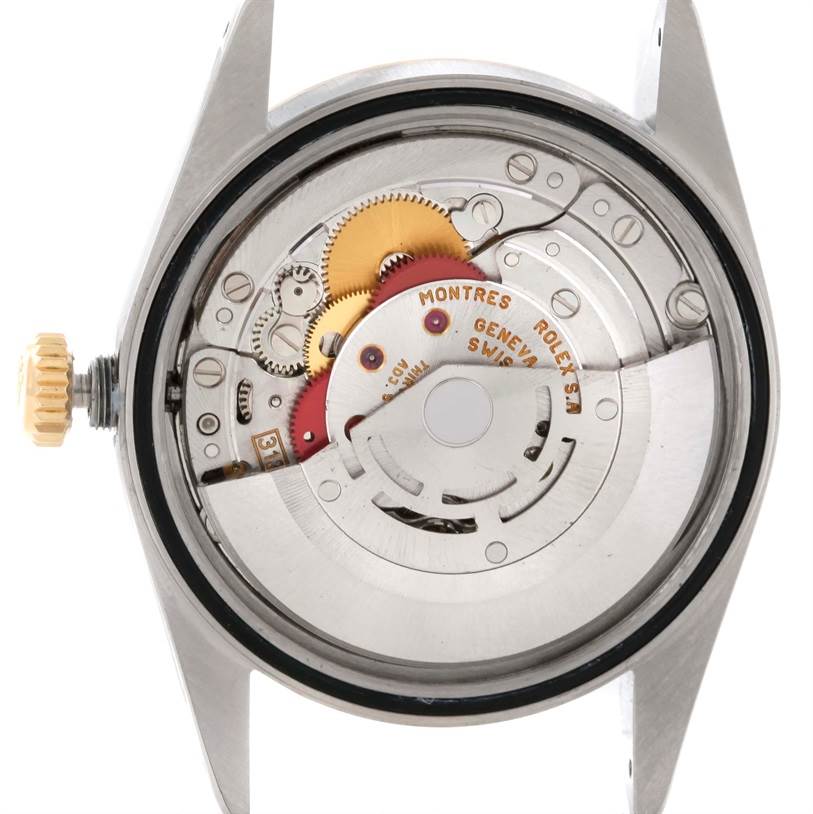 This image shows the inside movement of a Rolex Datejust 16233 Men's Steel and Gold (two tone) Beige Dial 16233 Men's Steel and Gold (two tone) Beige Dial watch, viewed from the back without the case back.