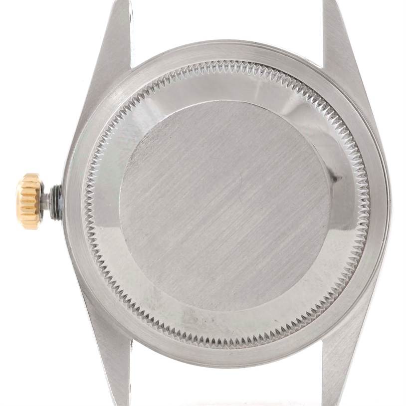 The image shows the back case and crown of a Rolex Datejust 16233 Men's Steel and Gold (two tone) Beige Dial 16233 Men's Steel and Gold (two tone) Beige Dial model watch, viewed from the rear.