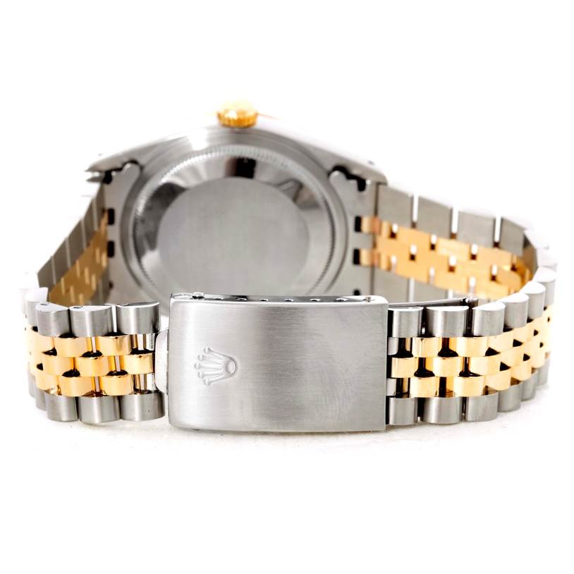 The image shows the reverse side and clasp of a Rolex Datejust 16233 Men's Steel and Gold (two tone) Beige Dial 16233 Men's Steel and Gold (two tone) Beige Dial watch, including its two-tone bracelet.