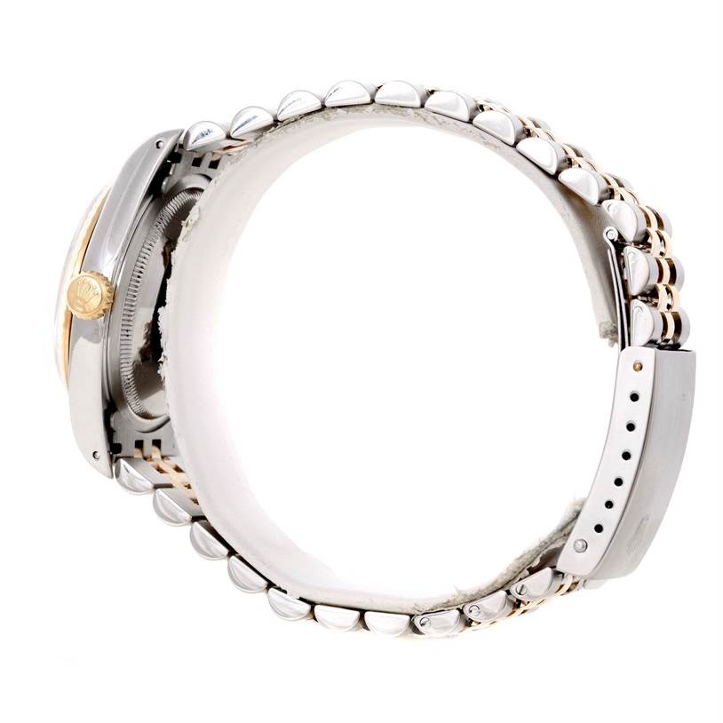 The image shows a side view of a Rolex Datejust 16233 Men's Steel and Gold (two tone) Beige Dial 16233 Men's Steel and Gold (two tone) Beige Dial watch highlighting its bracelet and crown.