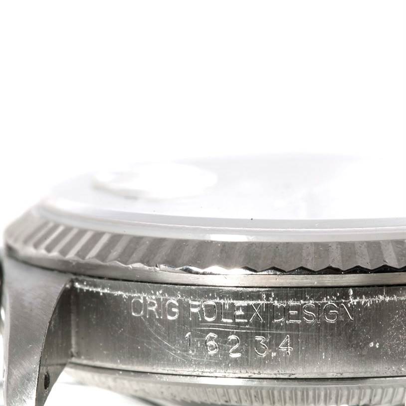 This image shows the side of a Rolex Datejust 16234 Men's Stainless Steel Silver Dial 16234 Men's Stainless Steel Silver Dial watch case, focusing on the engraved design and model number "16234".