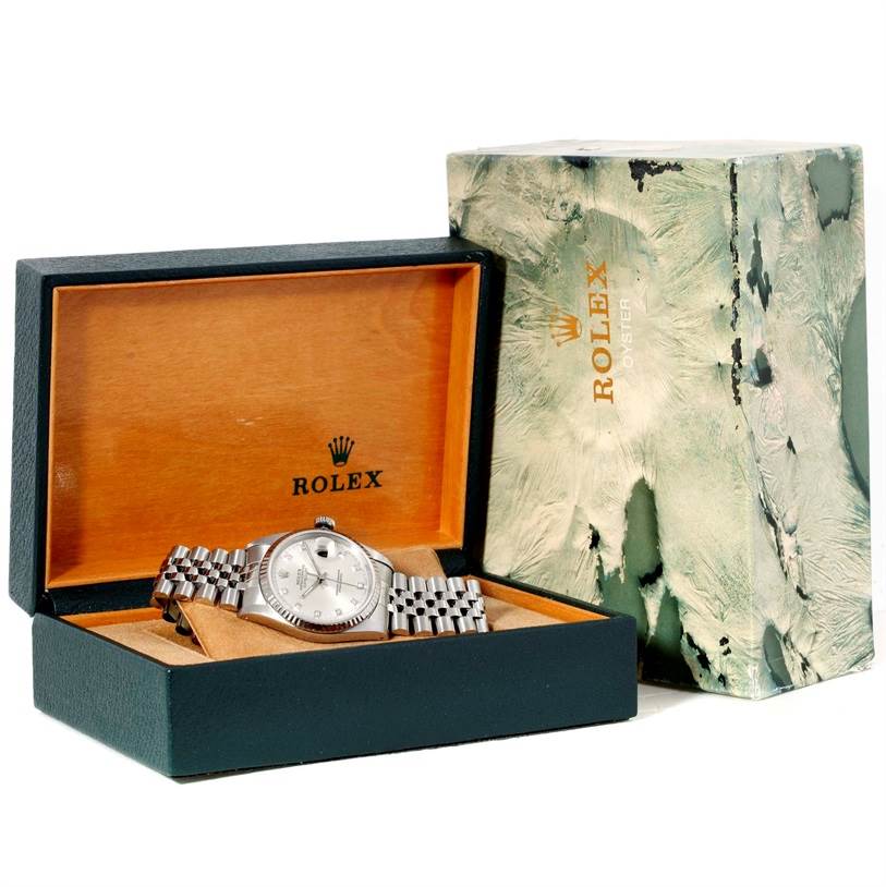 The Rolex Datejust 16234 Men's Stainless Steel Silver Dial 16234 Men's Stainless Steel Silver Dial watch is shown in its open box, with the watch face and bracelet clearly visible.